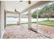 Screened patio with brick pavers and views of the fenced backyard at 3206 Hurley Grove Way, Valrico, FL 33596