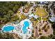 Aerial view of the community pool and playground, highlighting community amenities at 4206 Tour Trce, Land O Lakes, FL 34638