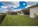 Spacious backyard with covered patio and wrought iron fence, perfect for outdoor activities at 4206 Tour Trce, Land O Lakes, FL 34638