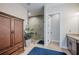 A glass-walled walk-in shower and granite topped vanity are the focal point of this bathroom at 4206 Tour Trce, Land O Lakes, FL 34638