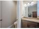 Cozy half bath with granite vanity and toilet featuring tile floors at 4206 Tour Trce, Land O Lakes, FL 34638