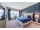 This bedroom features a blue accent wall and plush carpeting at 4206 Tour Trce, Land O Lakes, FL 34638