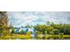 Scenic view of the clubhouse and surrounding landscaping, enhancing the community appeal at 4206 Tour Trce, Land O Lakes, FL 34638