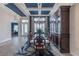 Elegant dining room with a coffered ceiling, large windows, and natural light at 4206 Tour Trce, Land O Lakes, FL 34638
