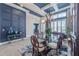 Formal dining room with coffered ceiling, decorative lighting, and stylish decor at 4206 Tour Trce, Land O Lakes, FL 34638