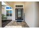 Welcoming front door with sidelights and transom window, set on a brick paver walkway at 4206 Tour Trce, Land O Lakes, FL 34638
