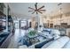 Expansive living room with open layout, featuring a view of the kitchen and dining area, and plenty of natural light at 4206 Tour Trce, Land O Lakes, FL 34638