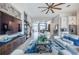 Spacious living room with a blend of stylish furnishings, large screen TV, open kitchen and dining at 4206 Tour Trce, Land O Lakes, FL 34638