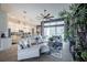 Bright, open living area with large ceiling fan and a seamless flow to the kitchen and dining spaces at 4206 Tour Trce, Land O Lakes, FL 34638