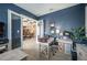 Bright office space with desk and chair, featuring elegant French doors and stylish blue accent wall at 4206 Tour Trce, Land O Lakes, FL 34638
