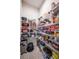 Pantry with wire shelves fully stocked with various food and household items for optimal organization at 4206 Tour Trce, Land O Lakes, FL 34638