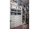 This walk-in closet has custom shelving and storage drawers at 4206 Tour Trce, Land O Lakes, FL 34638