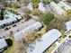 High aerial view of a well-maintained community with lush landscaping, mature trees and ample parking at 4215 E Bay Dr # 1701C, Clearwater, FL 33764