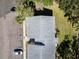 Aerial top-down view of a two-story residential building with ample parking and mature landscaping at 4215 E Bay Dr # 1701C, Clearwater, FL 33764