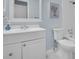 Clean bathroom featuring a white sink vanity, toilet, and shower with tub at 4215 E Bay Dr # 1701C, Clearwater, FL 33764