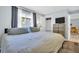 Bright bedroom featuring a chest of drawers with TV and closet at 4215 E Bay Dr # 1701C, Clearwater, FL 33764
