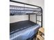 Close-up of a sturdy metal-framed bunk bed, a functional and space-saving sleeping arrangement at 4215 E Bay Dr # 1701C, Clearwater, FL 33764