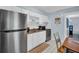 Bright kitchen featuring stainless steel refrigerator, oven and adjacent dining area at 4215 E Bay Dr # 1701C, Clearwater, FL 33764