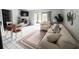 Bright living room featuring tile floors, comfortable seating, and sliding doors to a lanai at 4215 E Bay Dr # 1701C, Clearwater, FL 33764