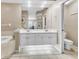 Bright bathroom featuring dual sinks, tiled floors, and separate tub at 4266 Preserve Pl # 4266, Palm Harbor, FL 34685
