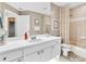 Bright bathroom with a white vanity, tiled shower, and neutral color scheme at 4266 Preserve Pl # 4266, Palm Harbor, FL 34685
