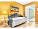 Bedroom with pull-out bed, wood floors, and sunny color palette at 4266 Preserve Pl # 4266, Palm Harbor, FL 34685