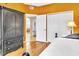 Bedroom with pull-out bed, wood floors, and large dresser at 4266 Preserve Pl # 4266, Palm Harbor, FL 34685