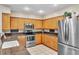 Updated kitchen with stainless steel appliances, granite countertops, and abundant cabinetry at 4266 Preserve Pl # 4266, Palm Harbor, FL 34685