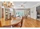 Spacious open floor plan connecting the dining and living areas, enhanced by natural light and elegant decor at 4266 Preserve Pl # 4266, Palm Harbor, FL 34685