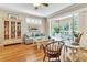 Bright and airy living room with a comfortable sofa, stylish decor, and access to a sunroom with a lush view at 4266 Preserve Pl # 4266, Palm Harbor, FL 34685
