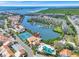 Gorgeous aerial view of waterfront community, marina, pool, and tennis courts, with stunning water views at 4312 Sunray Ct # 36, Tampa, FL 33615