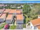 Inviting aerial view of townhomes featuring two-car garages, lush landscaping and a private driveways at 4312 Sunray Ct # 36, Tampa, FL 33615