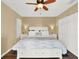 Bright bedroom features wood floor, ceiling fan, white furniture and natural light at 4312 Sunray Ct # 36, Tampa, FL 33615
