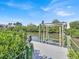 Picturesque waterfront with private dock and boat lift, set against lush mangroves and a clear blue sky at 4312 Sunray Ct # 36, Tampa, FL 33615