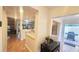 Inviting entryway with modern decor, opening to a view of the updated kitchen and outdoor patio with grill at 4312 Sunray Ct # 36, Tampa, FL 33615