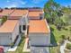 Well-maintained exterior with a private garage, orange roof, and manicured landscaping at 4312 Sunray Ct # 36, Tampa, FL 33615