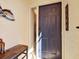 Close up of a blue front door with sidelight and transom window under a covered porch at 4312 Sunray Ct # 36, Tampa, FL 33615