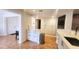 Updated kitchen with quartz countertop, white cabinets, and stainless steel trash receptacle on tile floors at 4312 Sunray Ct # 36, Tampa, FL 33615