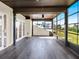 A sunlit lanai featuring durable floors, ceiling fans, and direct access to outdoor spaces through glass doors at 4312 Sunray Ct # 36, Tampa, FL 33615