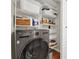 Convenient laundry room with shelving and modern washer at 4312 Sunray Ct # 36, Tampa, FL 33615