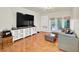 Relax in this cozy living room featuring tiled floors and a large TV at 4312 Sunray Ct # 36, Tampa, FL 33615