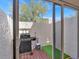 Enclosed patio area with a barbecue grill, providing an ideal space for outdoor cooking and relaxation at 4312 Sunray Ct # 36, Tampa, FL 33615