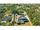 Expansive property with a pool, lush landscaping, and a serene atmosphere viewed from an aerial perspective at 4411 Culbreath Rd, Valrico, FL 33596