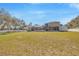 Expansive backyard with plenty of room, partial view of pool, privacy fence, and the home at 4411 Culbreath Rd, Valrico, FL 33596
