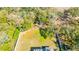 Aerial view of a fenced backyard with a pool and surrounded by mature trees at 4411 Culbreath Rd, Valrico, FL 33596