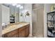 Bathroom with granite countertops, a glass shower, and decorative sea turtle accents at 4411 Culbreath Rd, Valrico, FL 33596