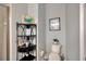 Powder room featuring a charming corner shelf, framed art, and stylish fixtures at 4411 Culbreath Rd, Valrico, FL 33596