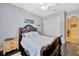 Bedroom featuring a large closet, dark wood floors and soothing neutral tones at 4411 Culbreath Rd, Valrico, FL 33596