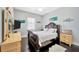 Comfortable bedroom featuring dark wood floors and unique fish-themed wall decor at 4411 Culbreath Rd, Valrico, FL 33596