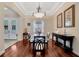 Formal dining room featuring rich wood floors and view into foyer at 4411 Culbreath Rd, Valrico, FL 33596